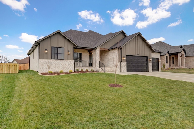 view of front of property featuring a front yard and a garage