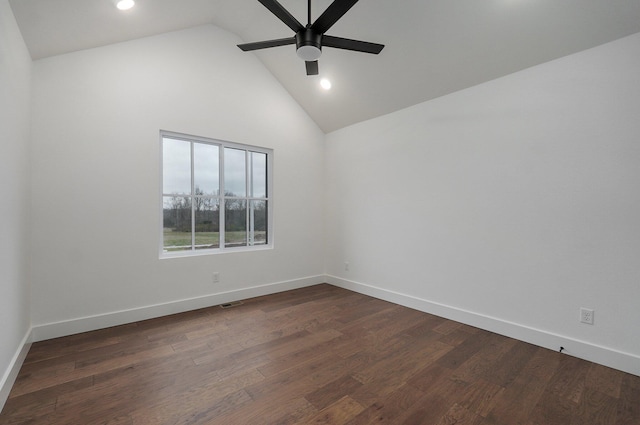 spare room with high vaulted ceiling, ceiling fan, and dark wood-type flooring