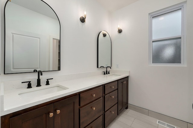 bathroom featuring tile patterned floors and vanity