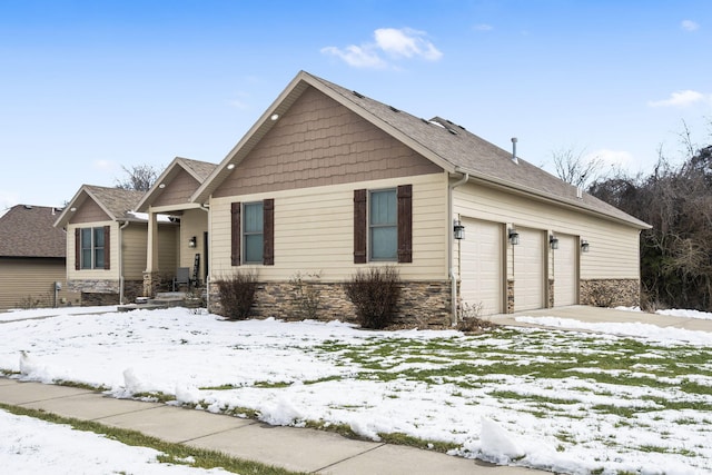 craftsman house with a garage