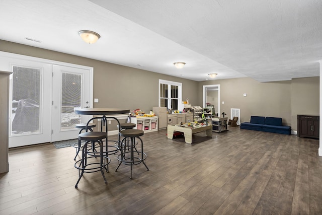 dining space featuring dark hardwood / wood-style flooring