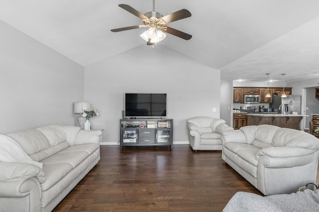 living room featuring ceiling fan, sink, lofted ceiling, and dark hardwood / wood-style floors