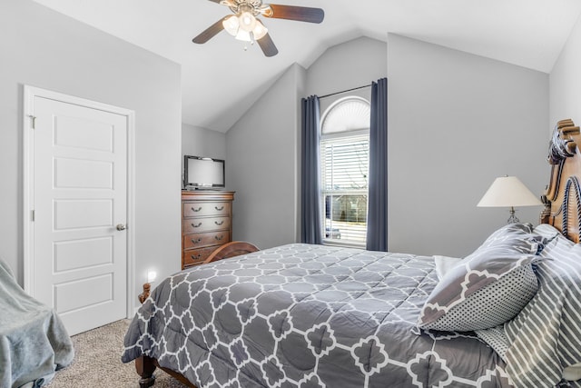 carpeted bedroom with vaulted ceiling and ceiling fan