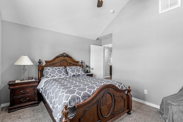 bedroom with ceiling fan, light colored carpet, and vaulted ceiling