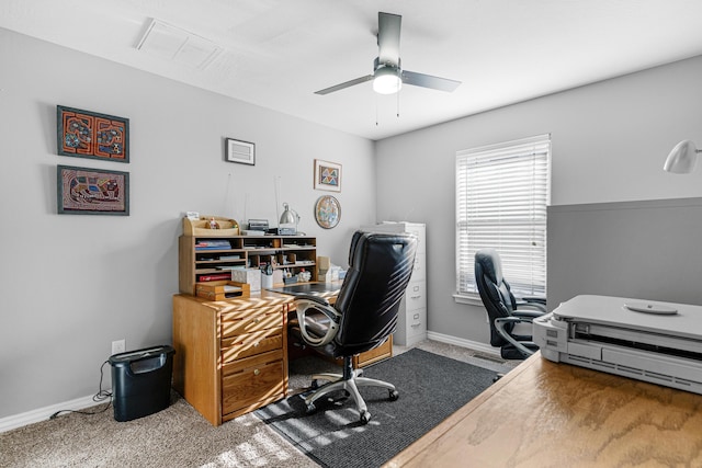 office with carpet floors and ceiling fan