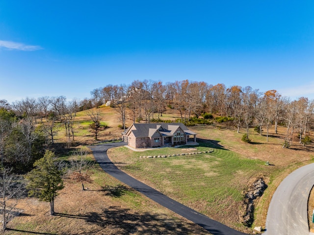 birds eye view of property with a rural view