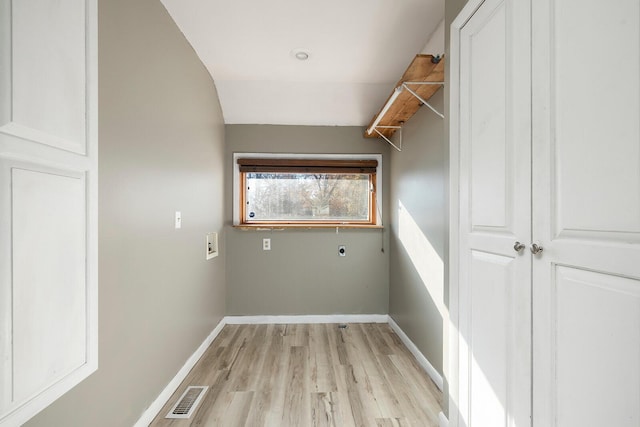 laundry area featuring light hardwood / wood-style flooring, hookup for an electric dryer, and hookup for a washing machine