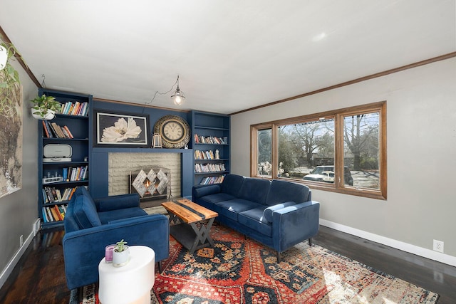 living room with dark hardwood / wood-style flooring, ornamental molding, and built in features