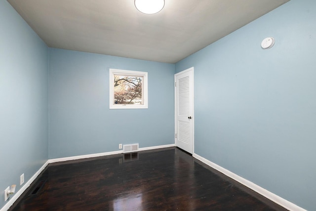 unfurnished room featuring hardwood / wood-style flooring