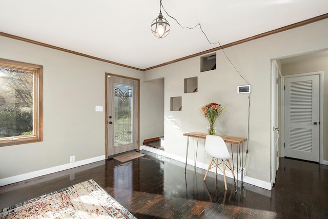 entrance foyer with crown molding and dark hardwood / wood-style floors