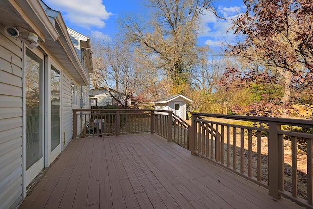 wooden deck with a storage unit