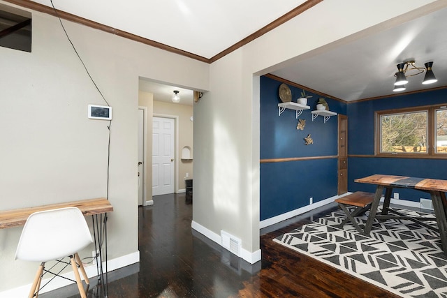 interior space featuring dark wood-type flooring and ornamental molding