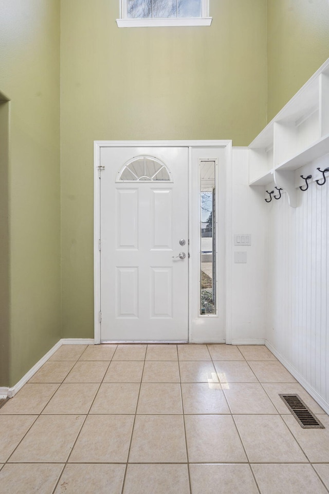 entryway with light tile patterned floors