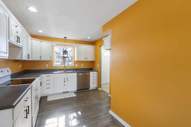 kitchen with pendant lighting, stainless steel dishwasher, white electric range, sink, and white cabinetry