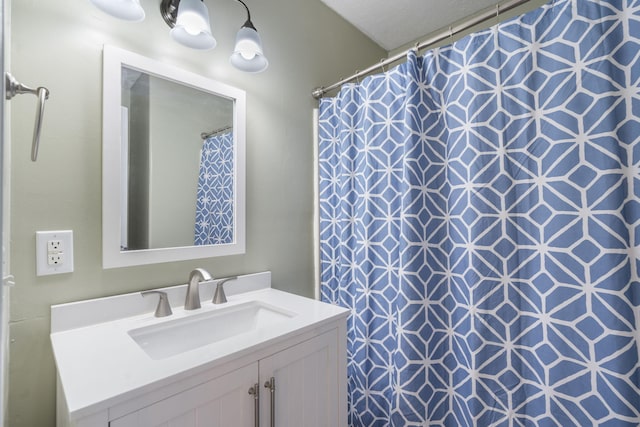 bathroom with vanity and a shower with curtain