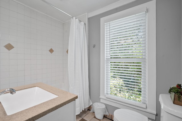 bathroom with tile patterned floors, vanity, toilet, and a shower with shower curtain