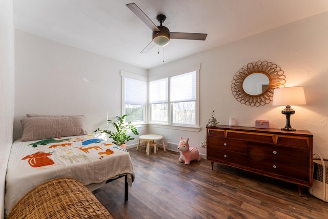 bedroom featuring ceiling fan and dark hardwood / wood-style floors