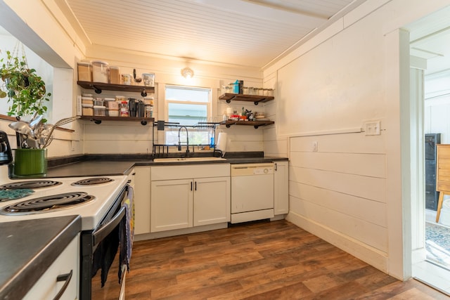 kitchen with electric stove, dark hardwood / wood-style floors, sink, white dishwasher, and white cabinets