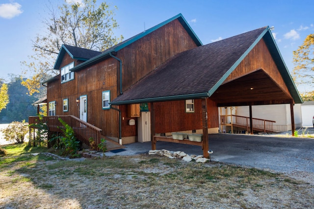 view of front facade with a wooden deck