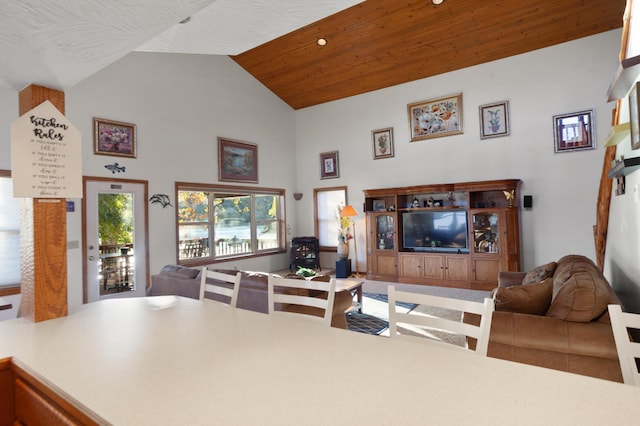 living room featuring wood ceiling and high vaulted ceiling