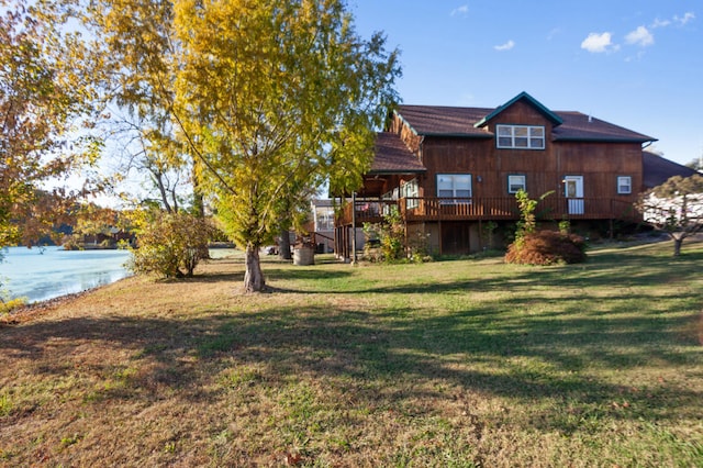 view of yard featuring a deck with water view