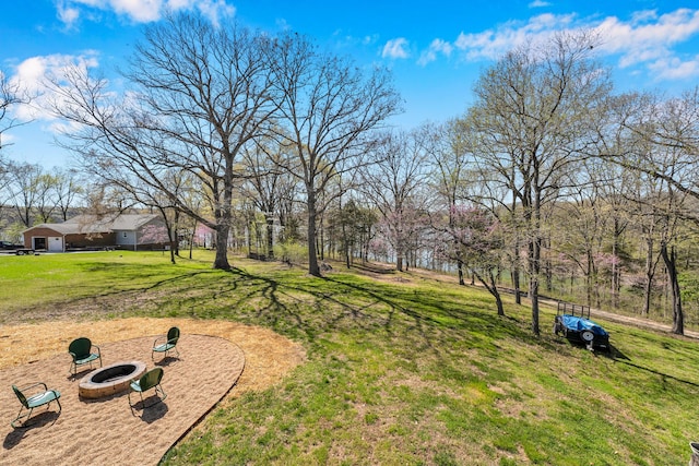 view of yard featuring a fire pit