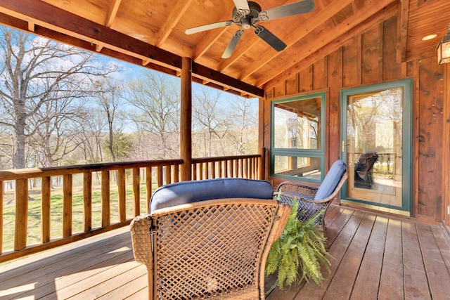 wooden deck featuring ceiling fan