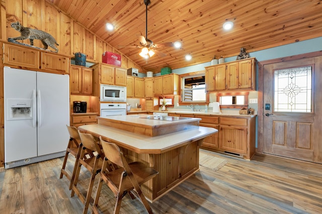 kitchen featuring white appliances, wooden ceiling, ceiling fan, a kitchen island, and light hardwood / wood-style flooring