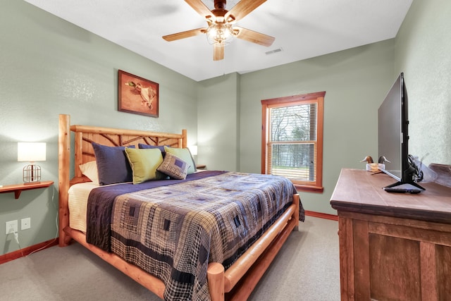 bedroom with light carpet and ceiling fan