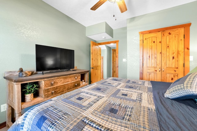 bedroom featuring ceiling fan and a closet