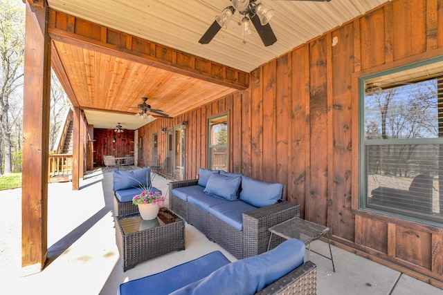 view of patio / terrace with ceiling fan and an outdoor living space