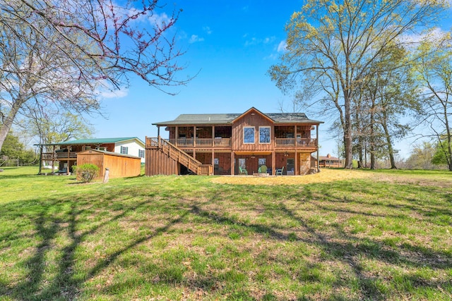 back of property featuring a yard and a deck