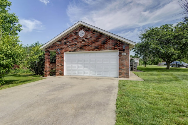 garage featuring a yard