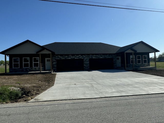 view of front of home with an attached garage and concrete driveway