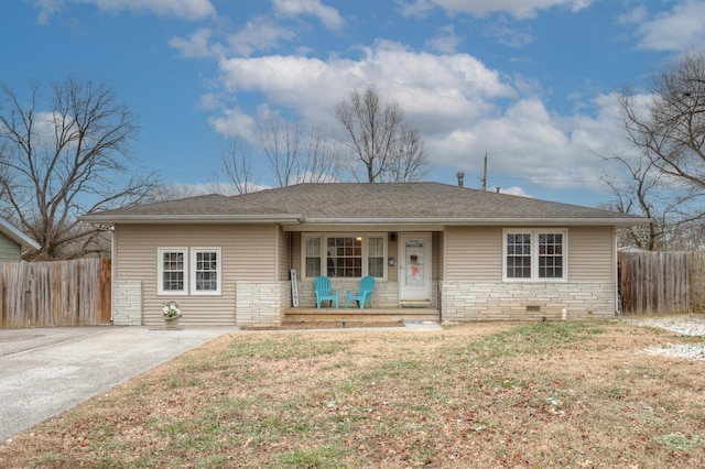 single story home with covered porch and a front lawn