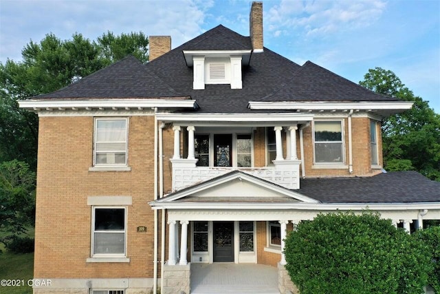 view of front of home with a balcony