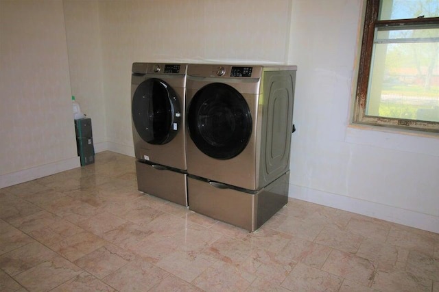 laundry room with independent washer and dryer