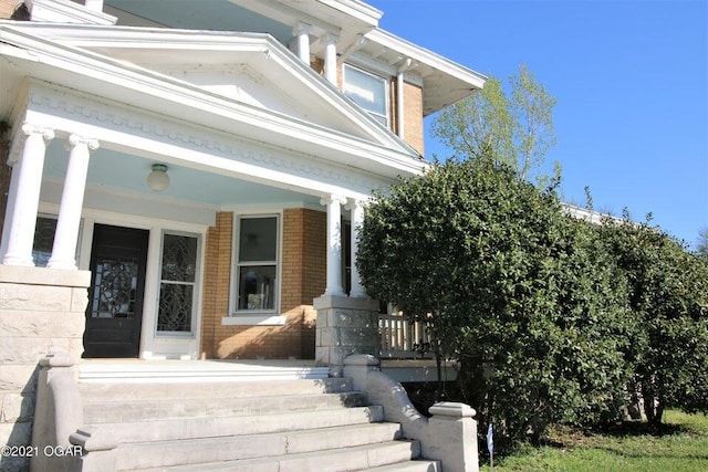 entrance to property with covered porch