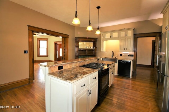 kitchen with decorative light fixtures, black appliances, a kitchen island, dark hardwood / wood-style flooring, and white cabinetry