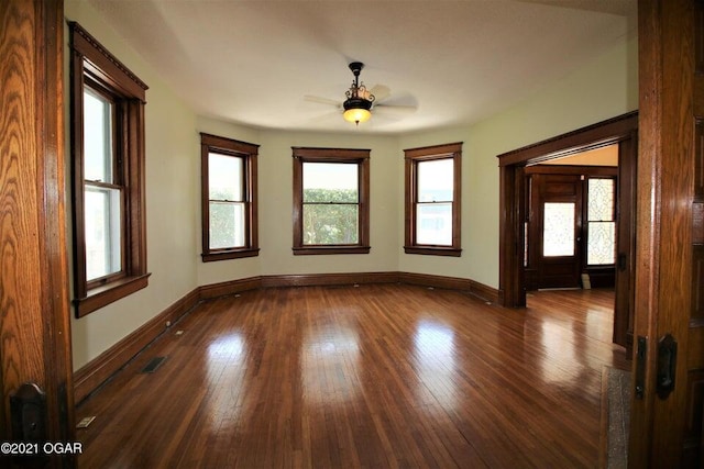 spare room featuring hardwood / wood-style floors and ceiling fan