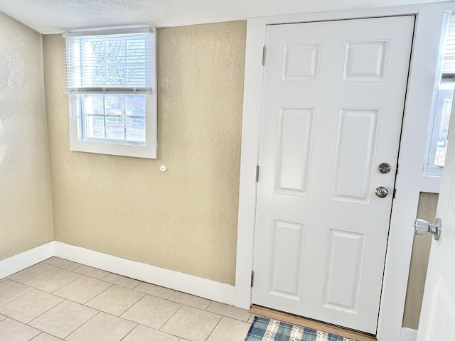 entrance foyer with light tile patterned flooring