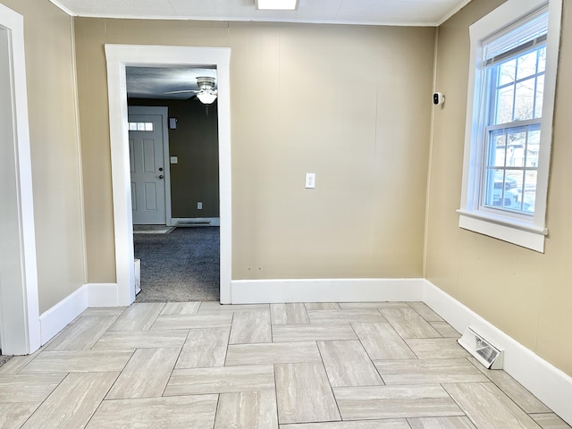 spare room featuring light parquet flooring and ceiling fan