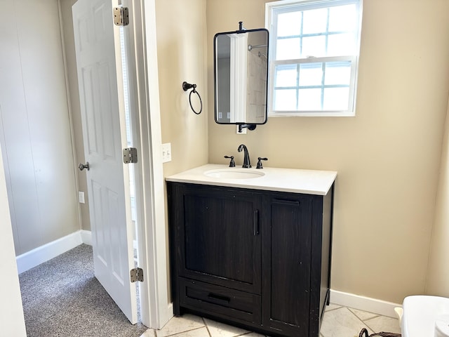 bathroom featuring tile patterned flooring and vanity