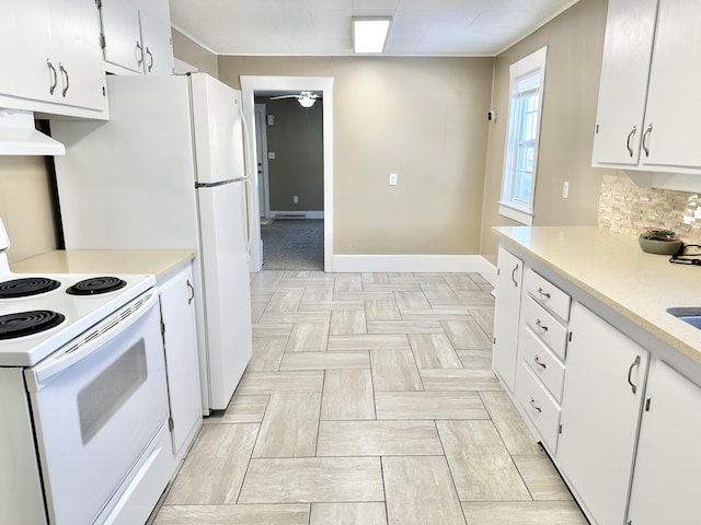 kitchen with custom exhaust hood, white electric stove, white cabinetry, and decorative backsplash