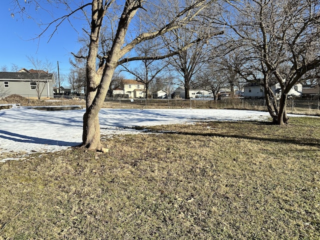 view of yard layered in snow