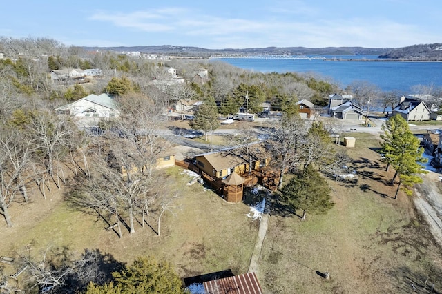 birds eye view of property with a water and mountain view