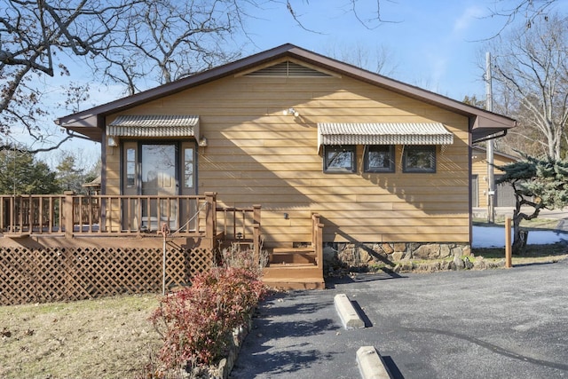 bungalow-style house featuring a deck