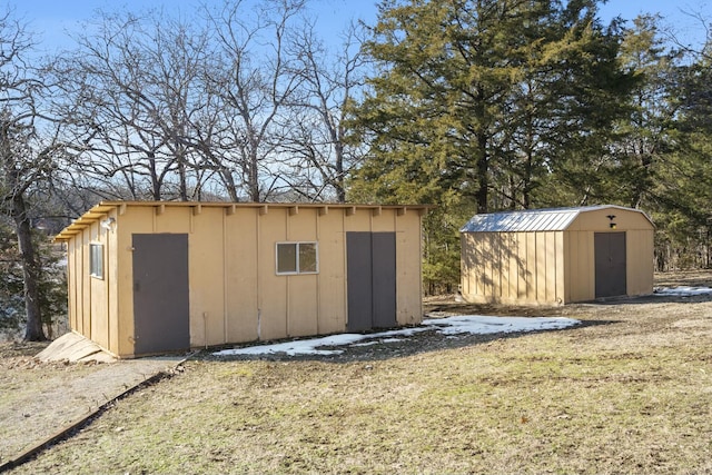 view of outbuilding featuring a lawn