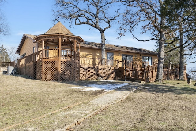 exterior space featuring a yard and a wooden deck