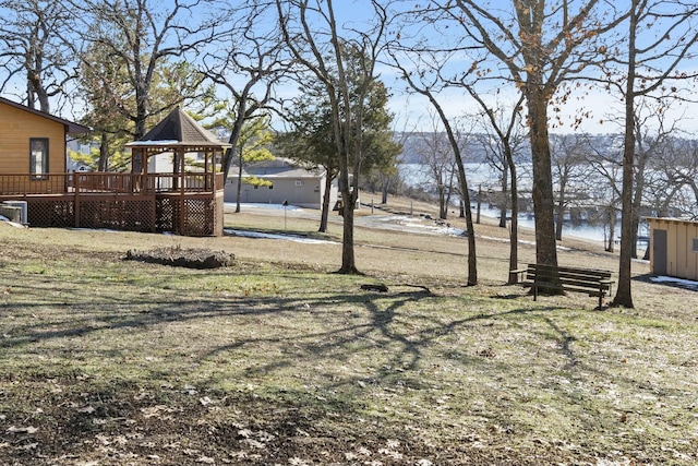 view of yard with a gazebo and a water view